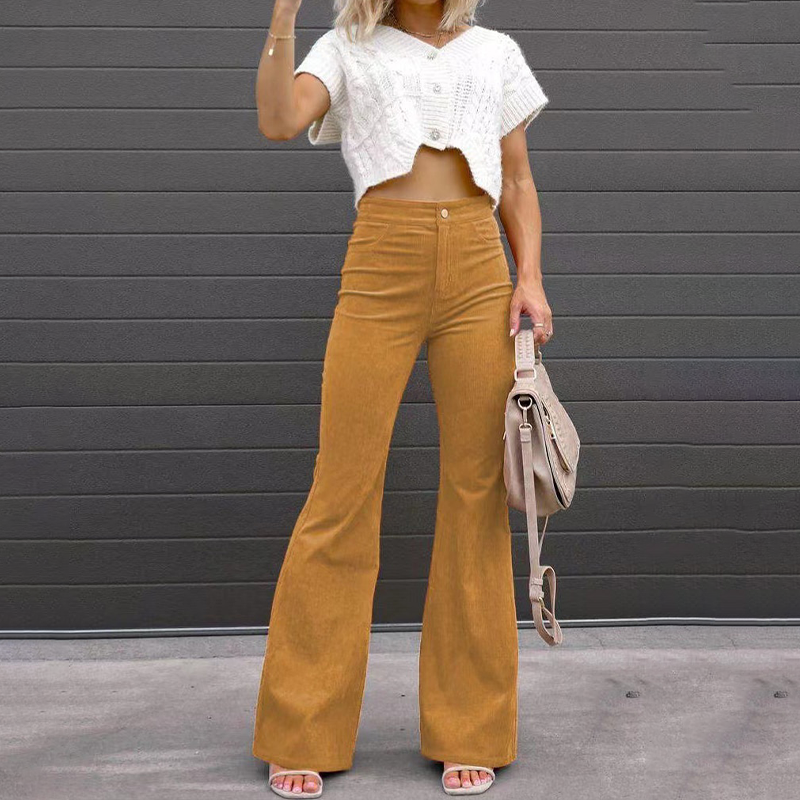 Side view of women's comfortable ribbed flared pants, highlighting the elegant high-waisted retro fit.