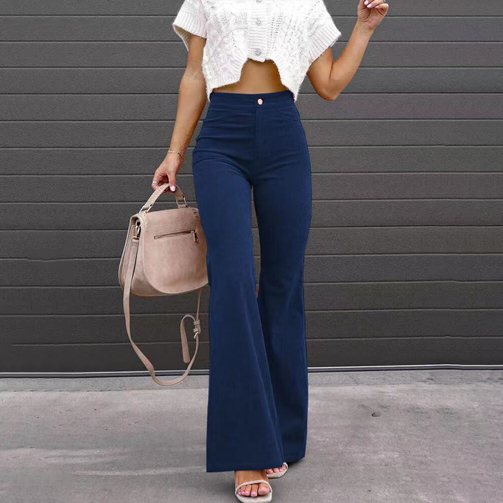 Fashionable women's high-waisted ribbed trousers, designed with a retro flared leg for modern comfort.