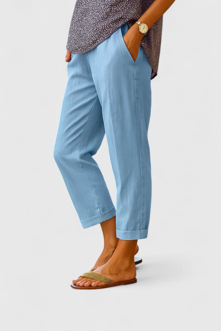 Women's high-waisted tailored cuff straight leg ankle pants in classic navy, perfect for smart casual or professional wear.