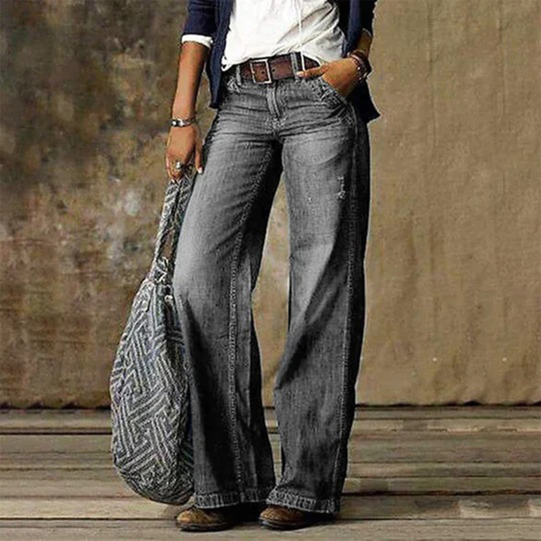 Close-up of the stylish high-waisted wide-leg denim jeans, highlighting the fabric and cut.