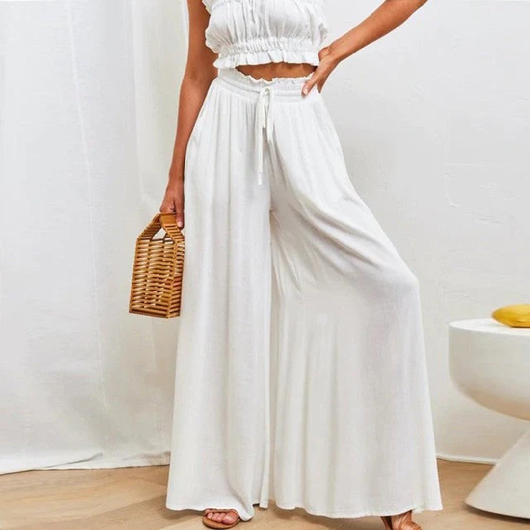 Women's high waisted wide leg palazzo pants in black, perfect for effortless summer style.