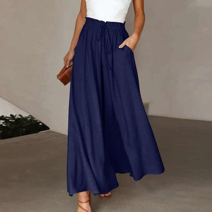 Flowy wide leg palazzo pants for women, featuring a comfortable high waist and drawstring.