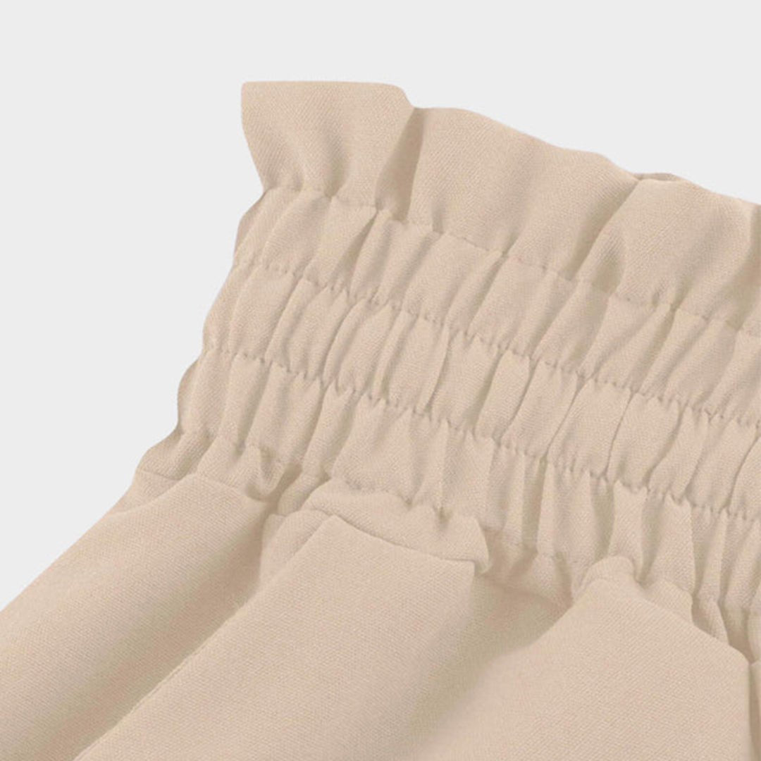 Women's flowy palazzo pants with a high waist and wide leg, providing comfortable and stylish spring wear.