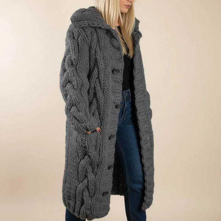 Comfortable women's long winter cardigan. Hooded design & cozy knit for everyday elegance.
