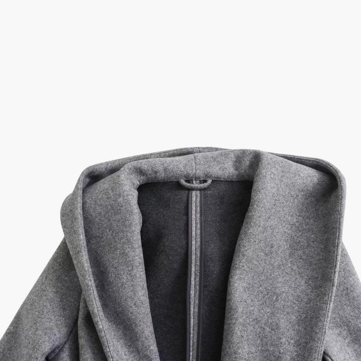 Ladies' long hooded trench coat with button-front closure. Ideal for casual outdoor style & all seasons.