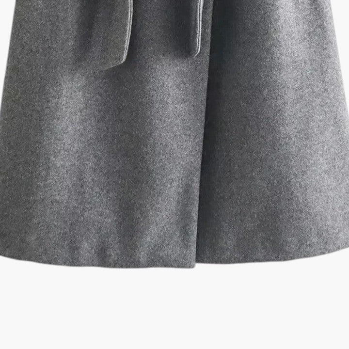 Chic women's hooded trench coat with a flattering belted waist. Button-front closure for spring outerwear.
