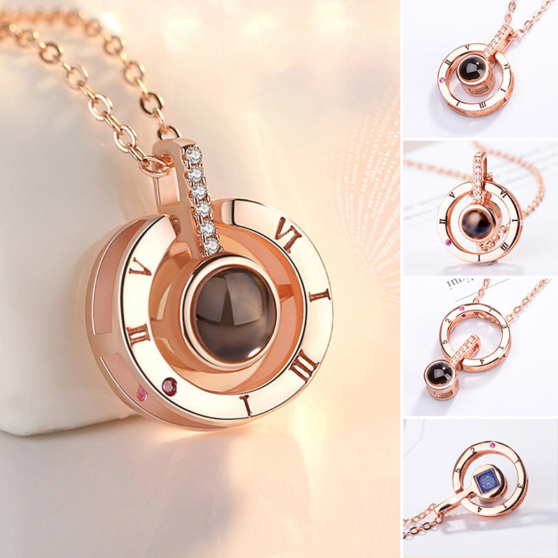 Women's 'I Love You' projection necklace with heart pendant, rose gold finish, perfect romantic gift.