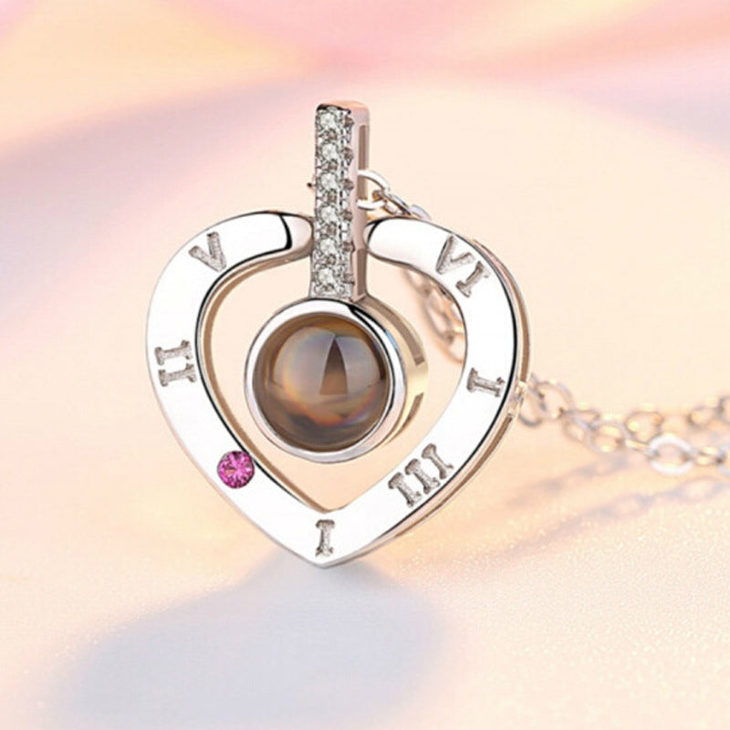 Rose gold 'I Love You' projection heart pendant necklace, an elegant piece of women's jewelry.