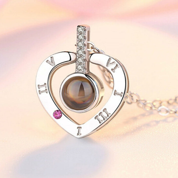 Rose gold 'I Love You' projection heart pendant necklace, an elegant piece of women's jewelry.