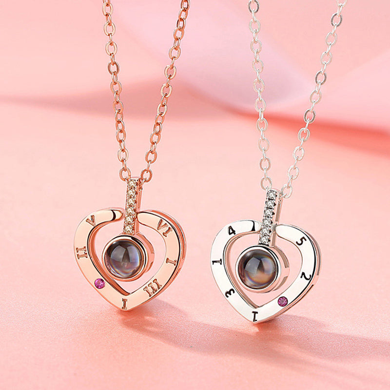 Detail of the 'I Love You' projection in 100 languages from the silver pendant necklace.