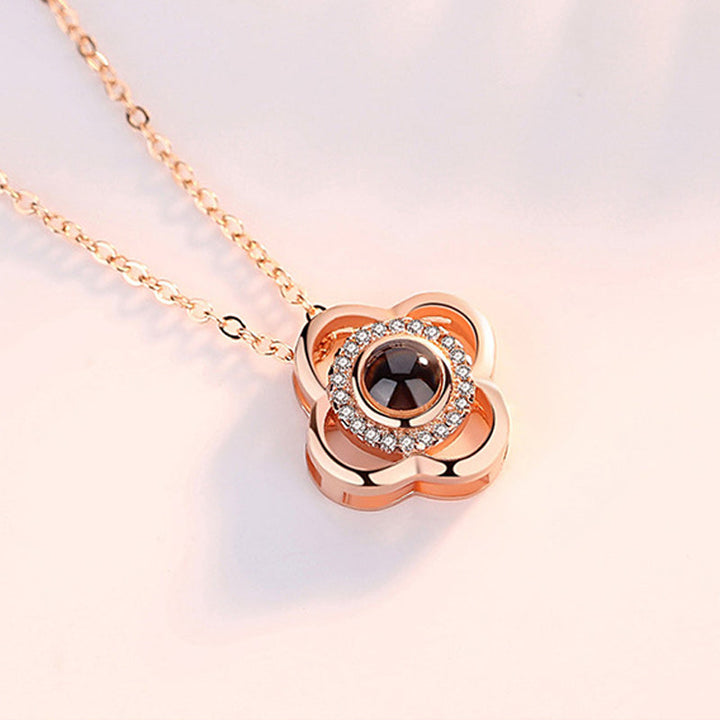 Women's rose gold 'I Love You' projection necklace, a symbolic and beautiful romantic gift.