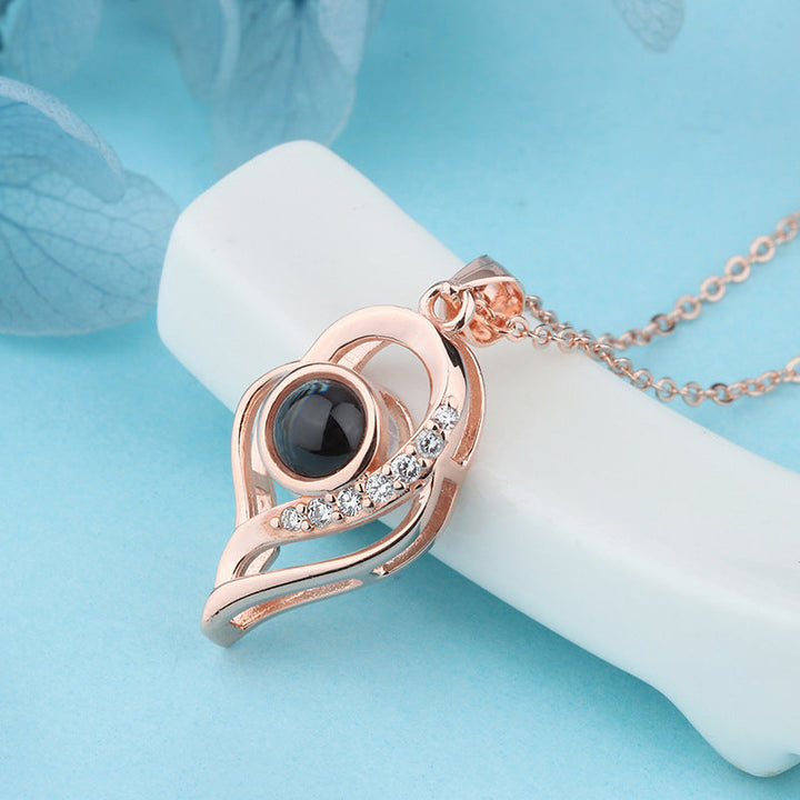 A collection of silver 'I Love You' projection necklaces, showcasing their uniform elegant design.