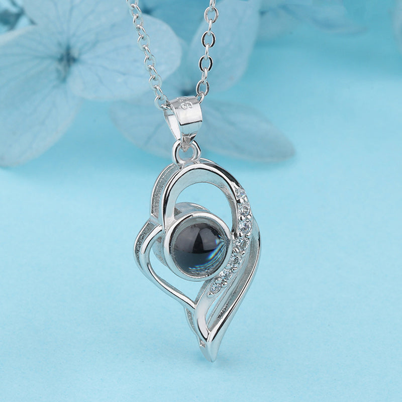Silver 'I Love You' projection necklace, designed for women who appreciate sentimental jewelry.