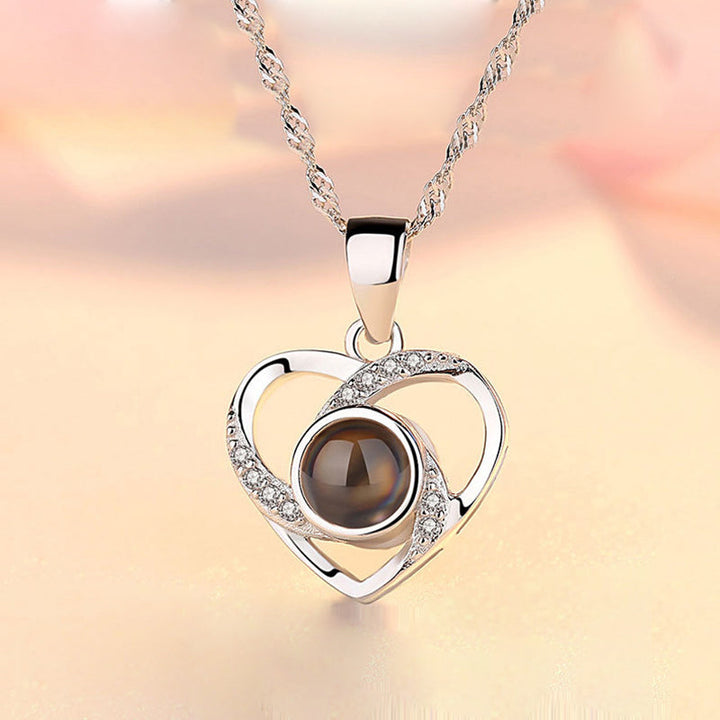 Silver '100 Languages I Love You' pendant, a beautiful and thoughtful anniversary gift for her.