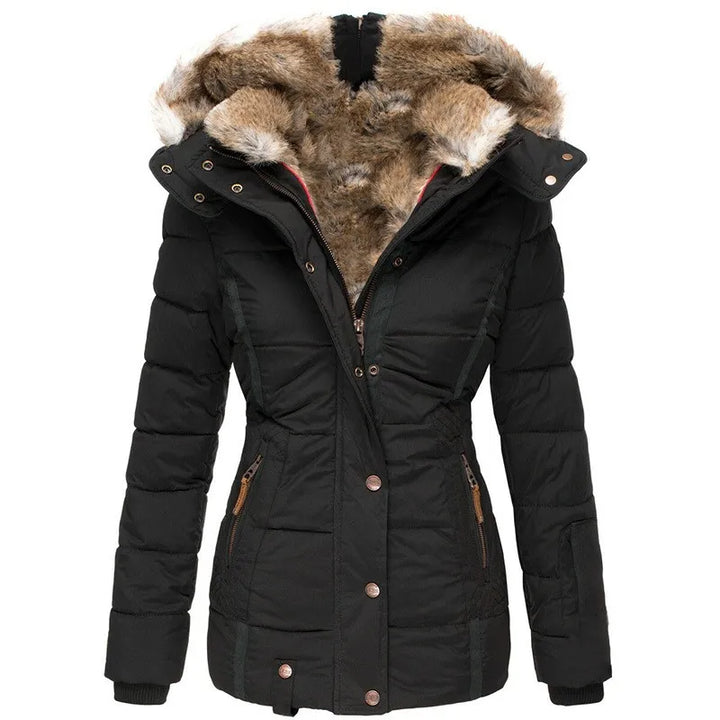 Stylish women's winter jacket. Insulated, warm outerwear for cold weather. Features a cozy design.