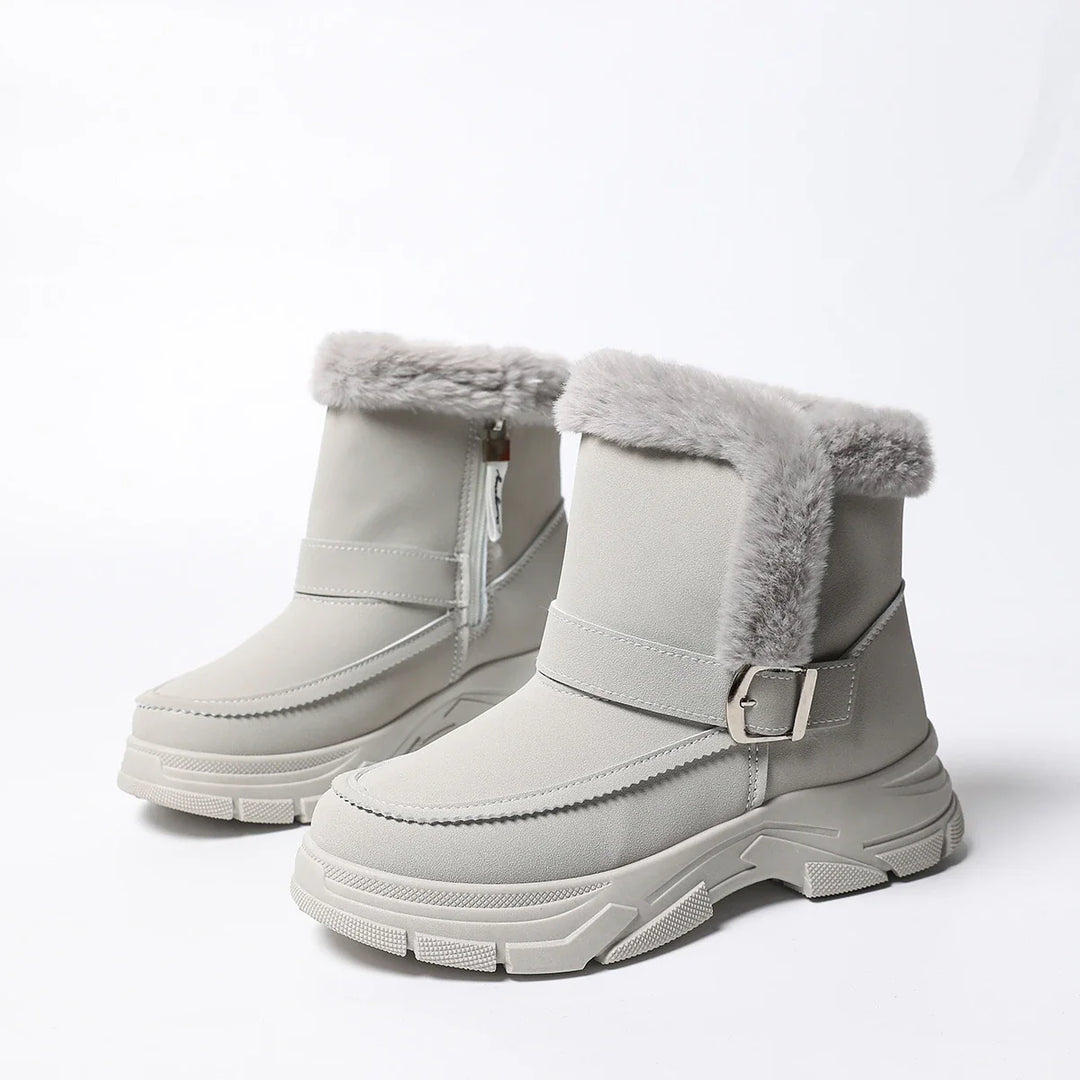 Indoor shot of unpacked women's gray faux fur lined boots, comfy & chic