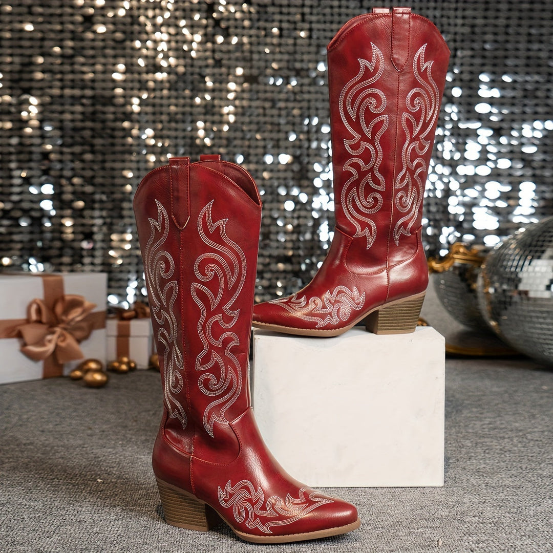 Women's riding style cowboy boots. Knee-high, block heel, pointed toe for a classic western look.