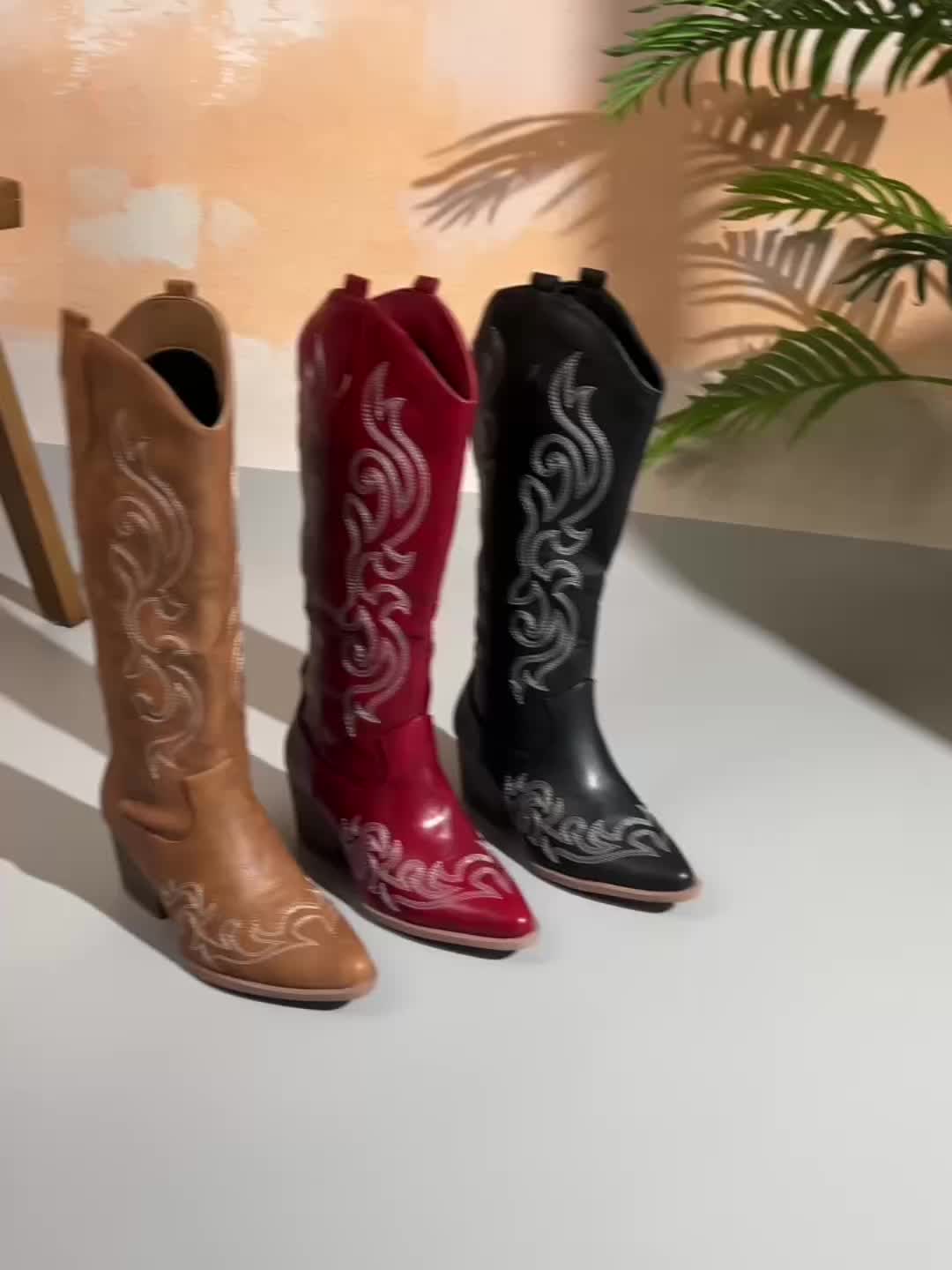 Brown women's cowboy boots. Knee-high, block heel, pointed toe, perfect for western outfits.