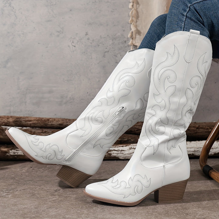 Knee-high red cowboy boots for women, featuring an elegant pointed toe and block heel.