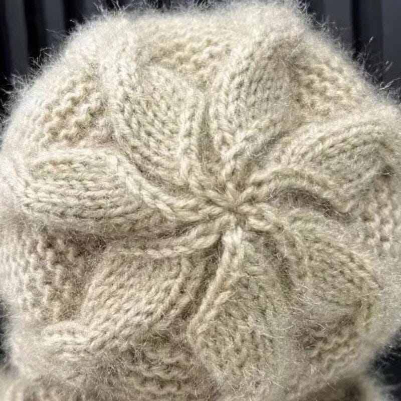 Cozy women's knit scarf with a ribbed texture, part of a winter accessories set