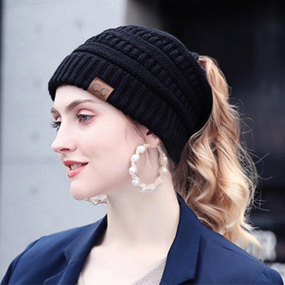 Model wearing a Women's Knit Ponytail Beanie Hat, showcasing the hair-friendly opening