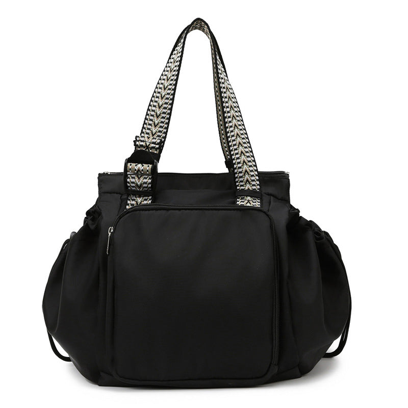 Black nylon women's convertible tote backpack, perfect for everyday essentials