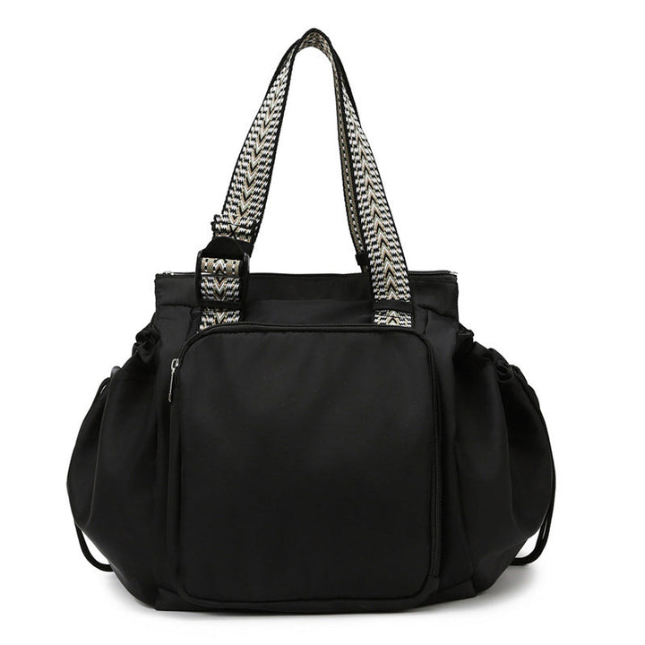 Black nylon women's convertible tote backpack, perfect for everyday essentials