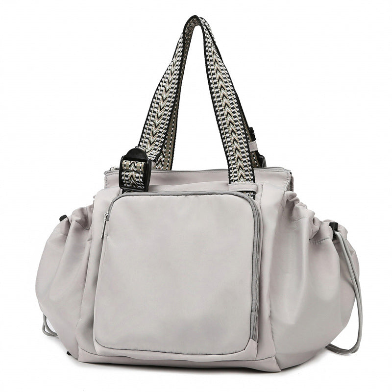 Large capacity women's tote backpack in black, durable nylon material