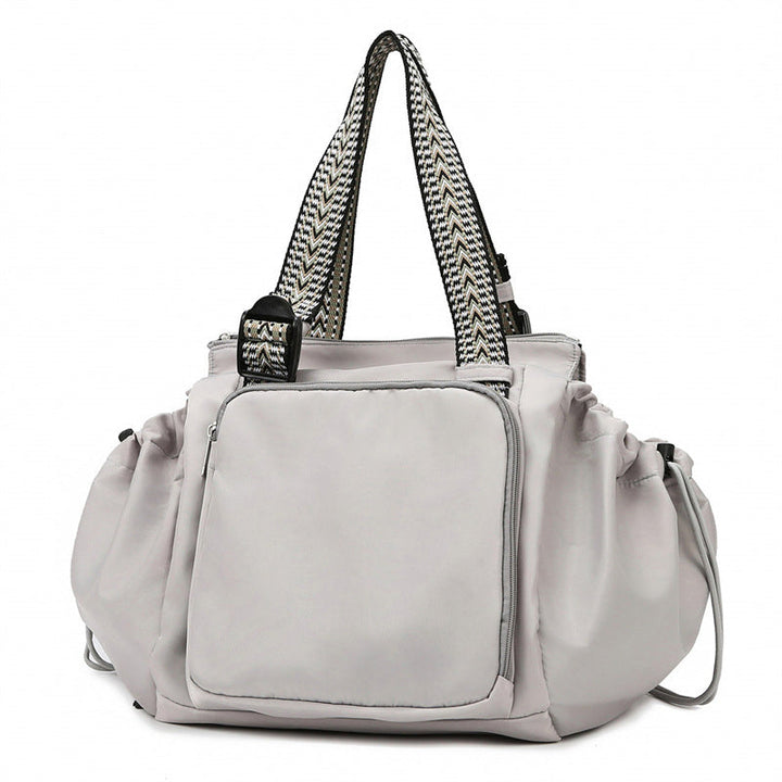 Large capacity women's tote backpack in black, durable nylon material