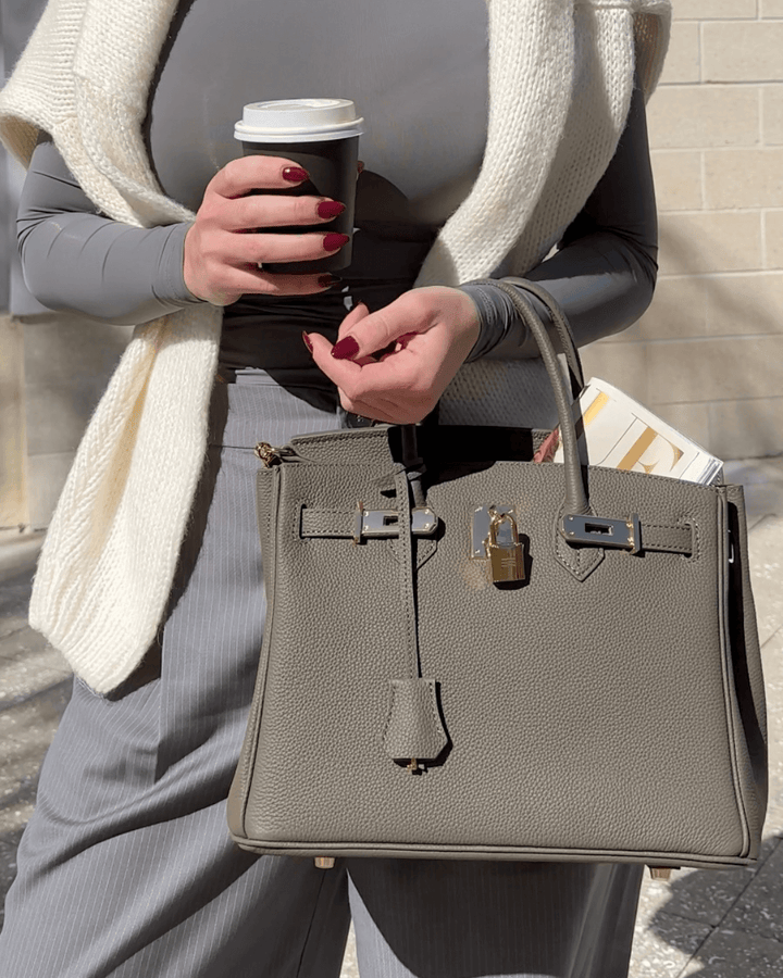 Designer quality women's leather handbag. Elegant, versatile, and spacious shoulder tote.