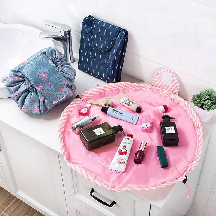 Portable waterproof oxford cloth makeup organizer for women, laid flat to display all contents, with a purple floral design.