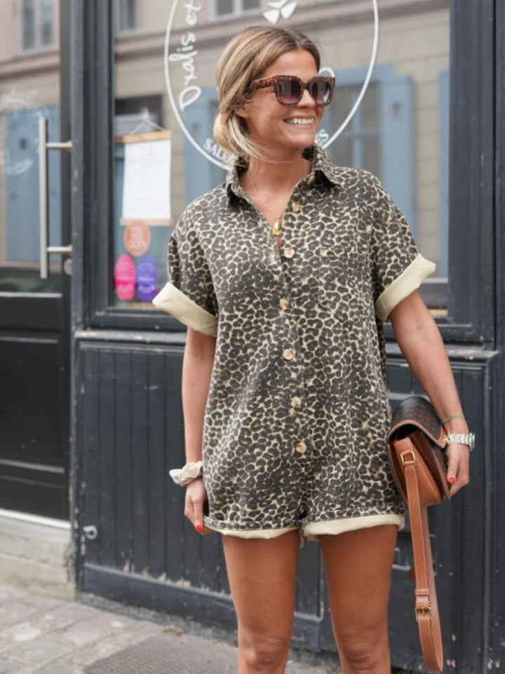 Fashionable women's leopard print romper, one-piece design, ideal for a casual summer outfit.