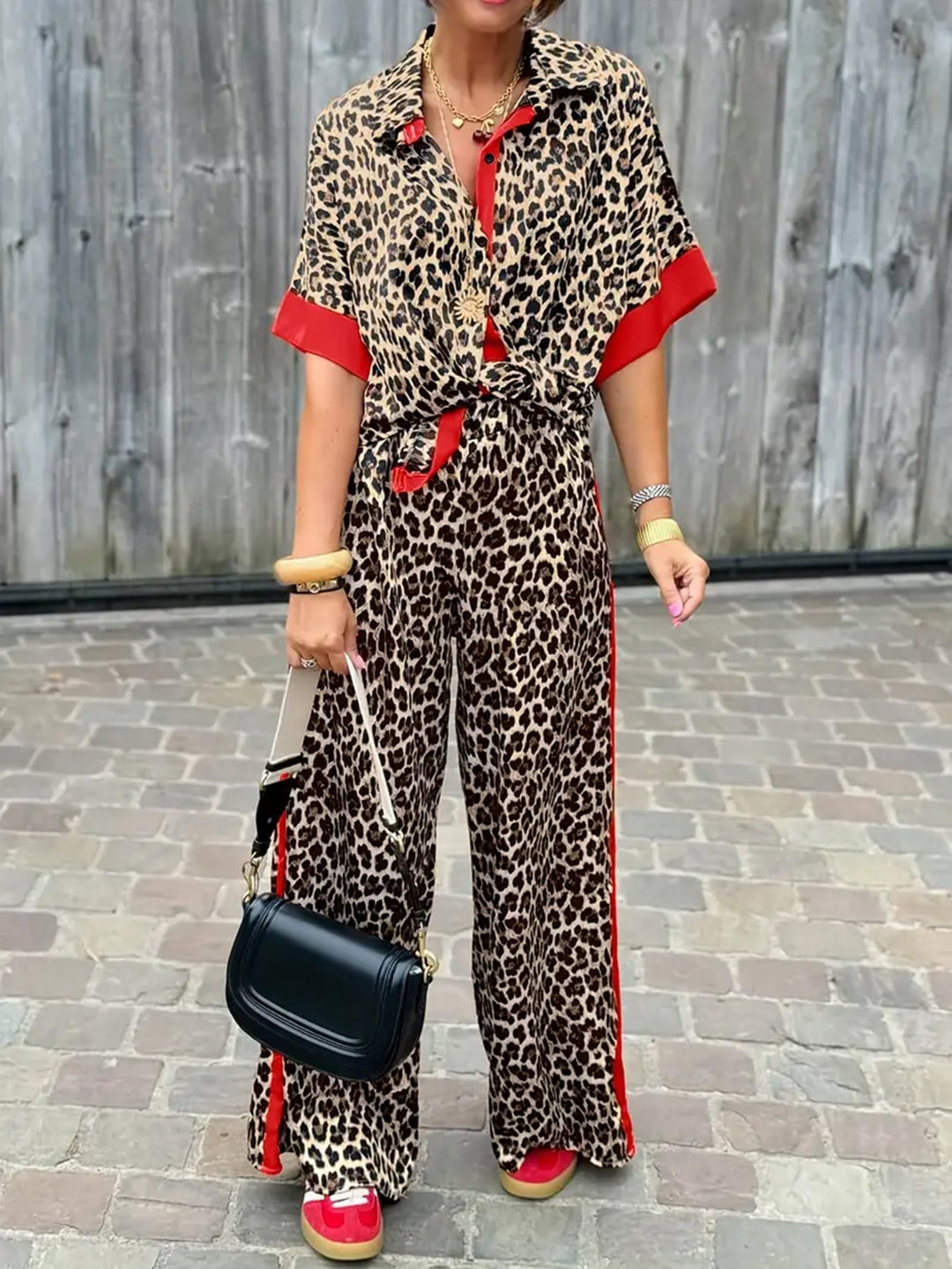 Women's leopard print wide leg v-neck jumpsuit. Stylish one-piece for casual or evening wear.