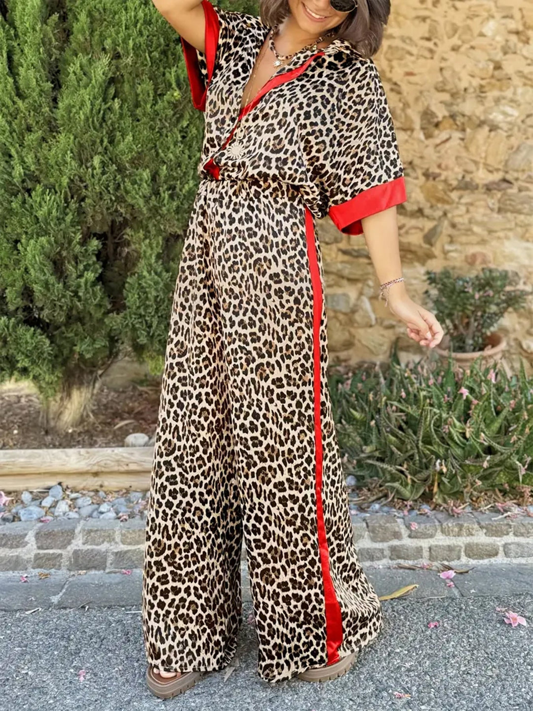 Relaxed fit women's leopard print jumpsuit with a wide leg & v-neck, perfect for comfort & style.
