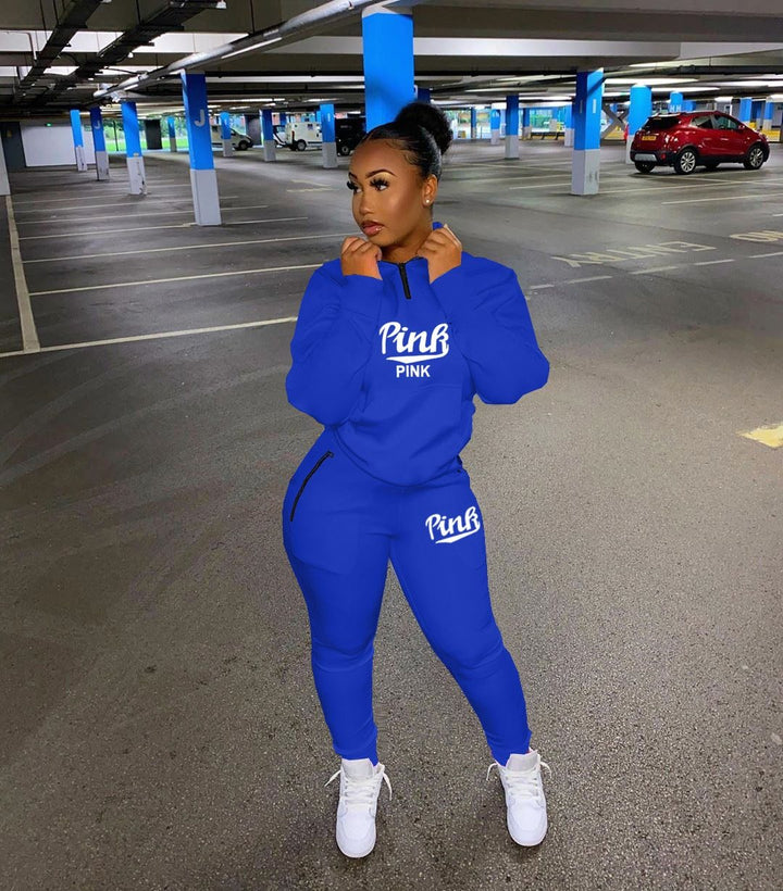 Stylish women's two-piece letter print tracksuit, a trendy activewear matching set.