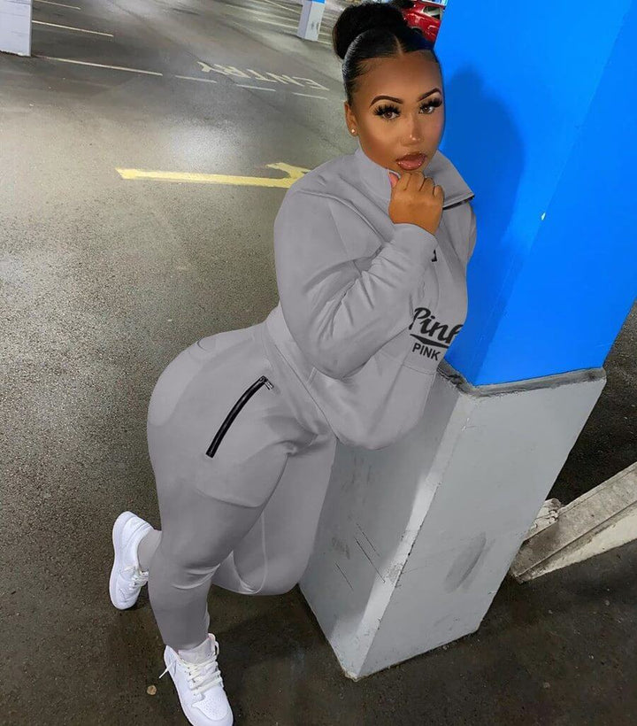 Trendy women's letter print two-piece tracksuit, a modern casual fashion statement.