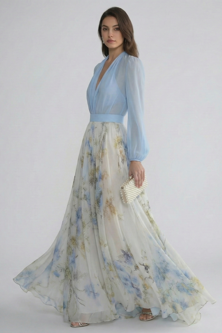 Flowing light blue maxi dress with V-neck & sheer sleeves, ideal as a casual or party dress for women.