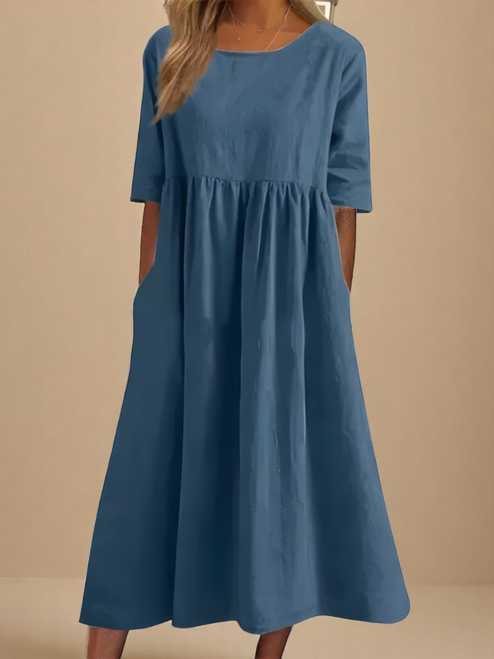 Women's lightweight flowy summer midi dress with a round neck, perfect for casual everyday wear.