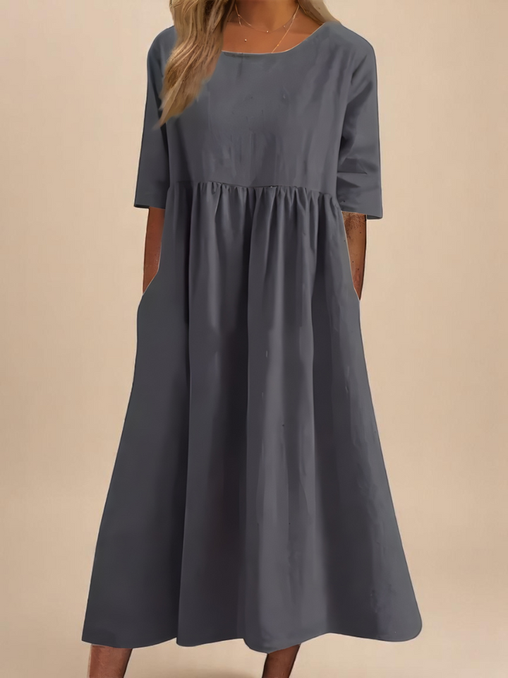 Comfortable & versatile women's flowy summer dress, ideal for spring fashion & travel; relaxed fit.