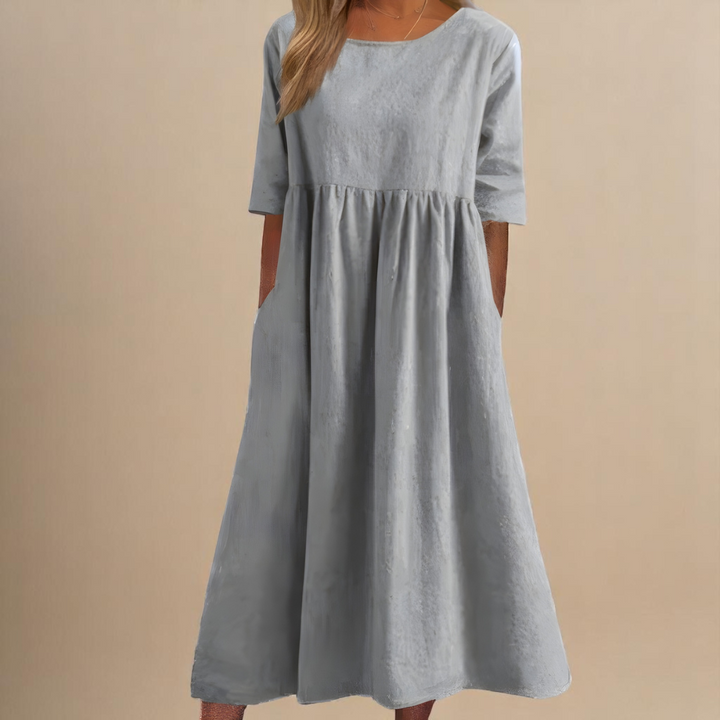Round neck women's lightweight midi summer dress with a flowy silhouette, perfect for spring/summer days.