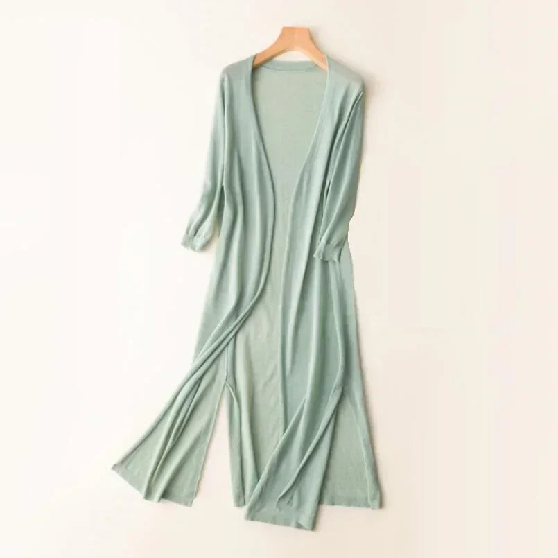 Flowy open front long cardigan for women, features side slits & 3/4 sleeves. Ideal for summer style.