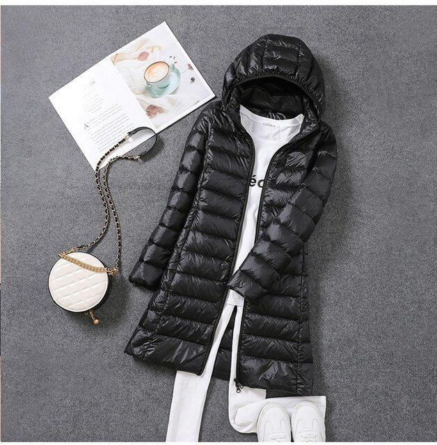 New women's long puffer jacket, lightweight design with a detachable hood for versatile fall fashion.