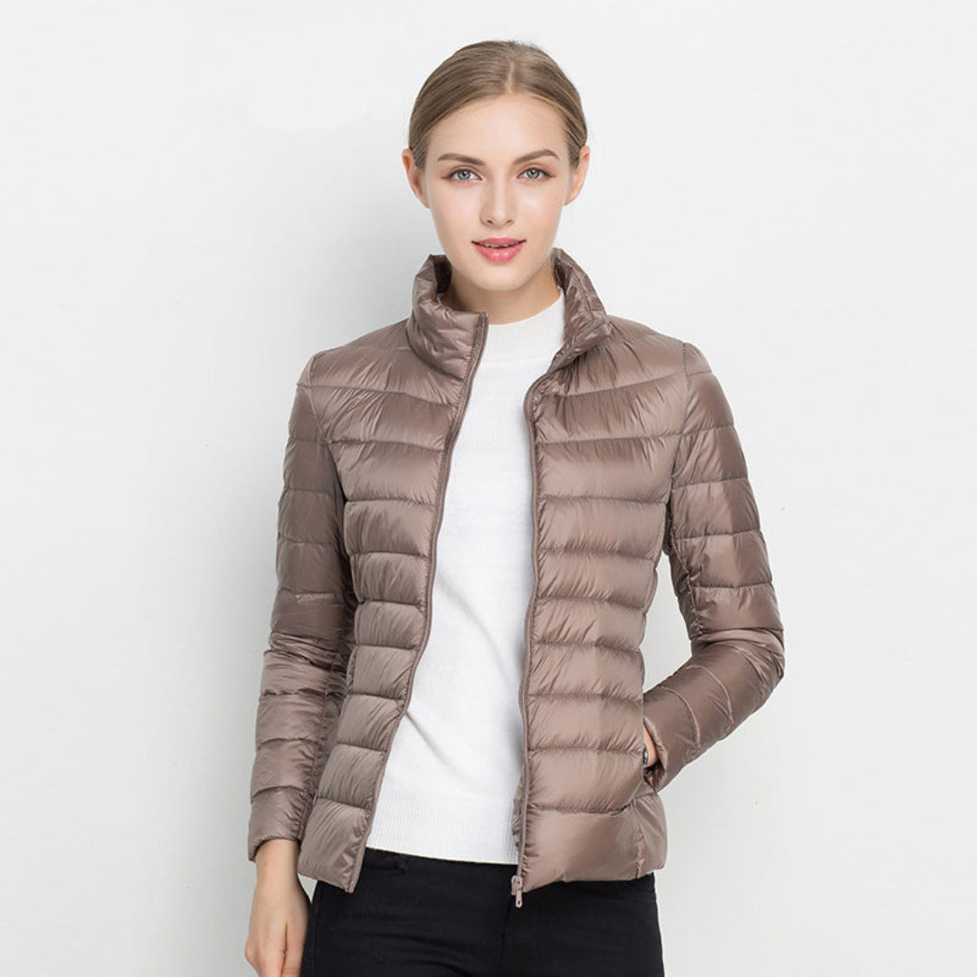 Warm women's quilted puffer jacket, perfect for winter and fall fashion, offering a casual and cozy look.