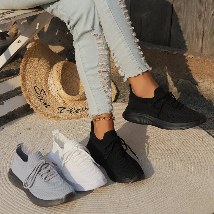 Neutral women's modern ribbed sneakers. Lightweight, comfortable, and versatile fashion footwear for casual outfits.