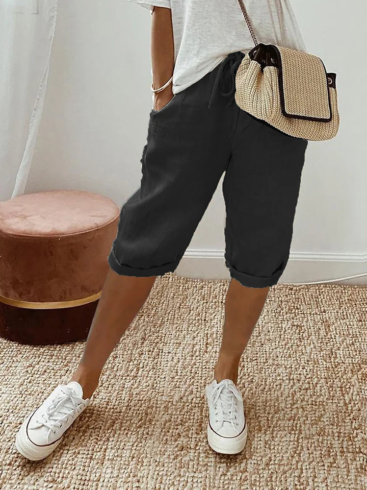 Women's lightweight summer comfort shorts with drawstring waist & pockets, ideal for warm weather casual wear.