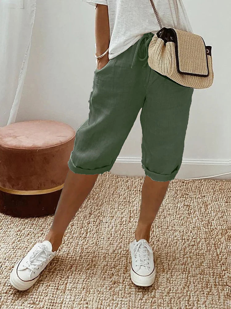 Women's comfortable summer shorts featuring a drawstring waist, pockets, and lightweight fabric for warm weather.