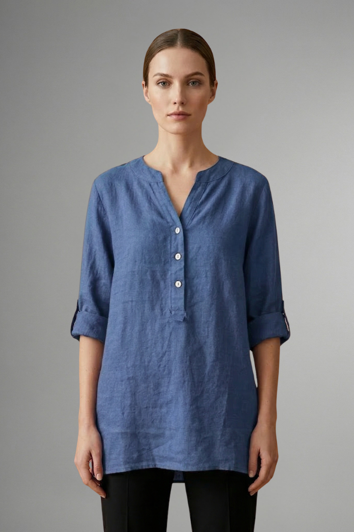 Loose fit women's linen blouse with button closure & roll sleeves. Comfortable V-neck for casual everyday summer wear.