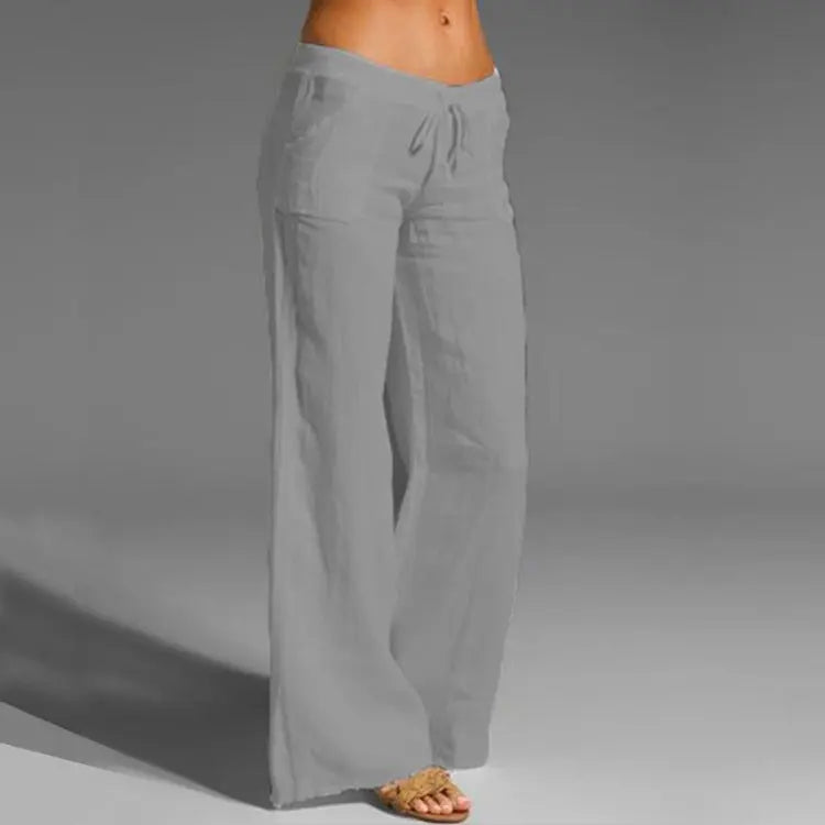 Loose fit women's linen travel pants with elastic waist for warm-weather comfort.