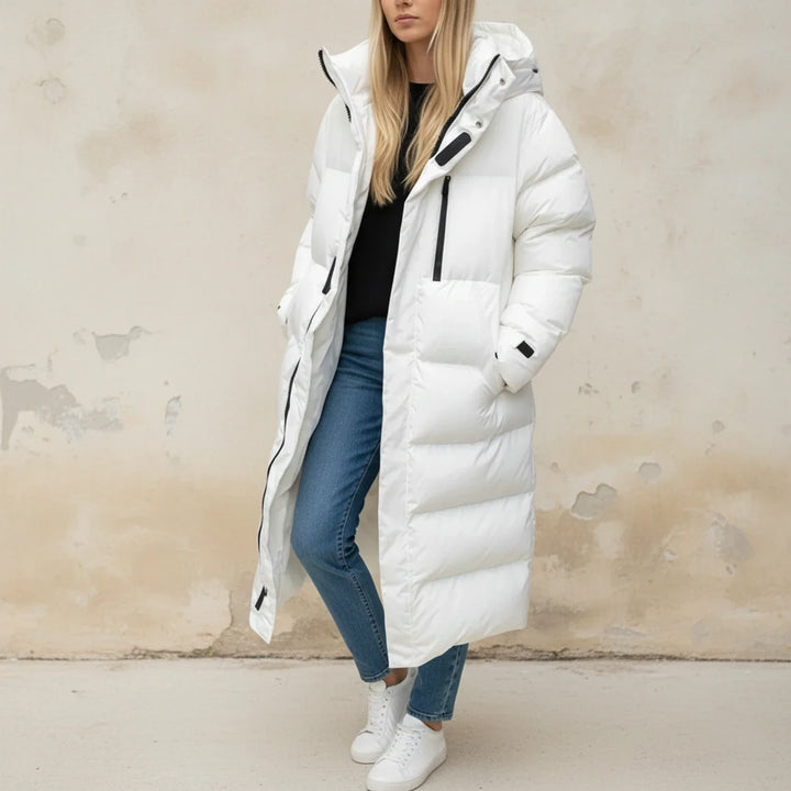 Comfortable women's long puffer winter jacket, perfect for ultimate warmth in cold weather. Insulated hooded outerwear.