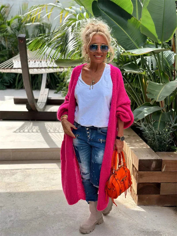 Cozy women's longline knit cardigan. An oversized bohemian statement piece for casual fashion.